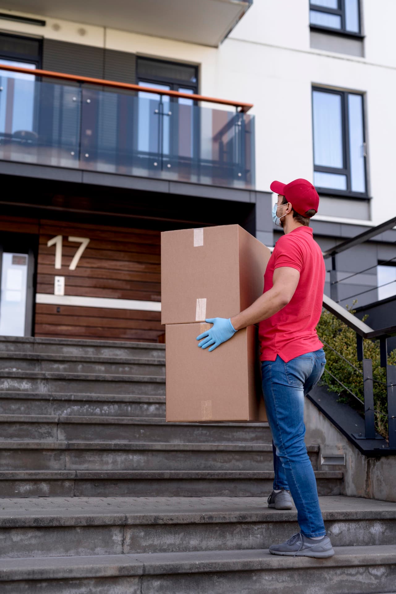 Carrying boxes up to a new home's entrance